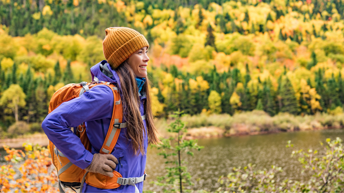 Backpacker hiking with a view of mountains, enjoying Lark Ellen Farm sprouted trail snacks  organic, lightweight, and nutrient-dense food for adventure.