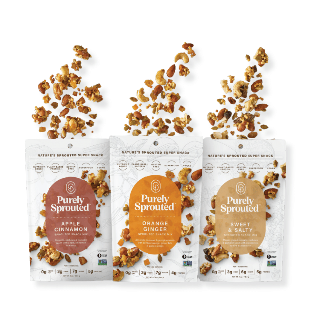 Three Purely Sprouted snack bags Apple Cinnamon Orange Ginger and Sweet & Salty with granola pieces tumbling above